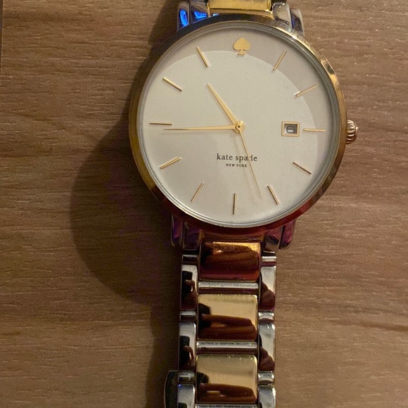 “Kate Spade” watch, gold/silver band. Used-but in good condition. Needs battery